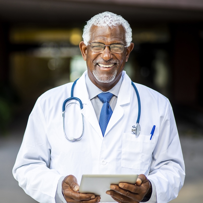 Portrait of a senior african american doctor at the hospital